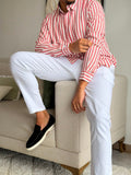 Red and white striped long-sleeve button-up shirt.