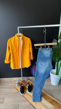 Bright yellow long-sleeve button-up shirt